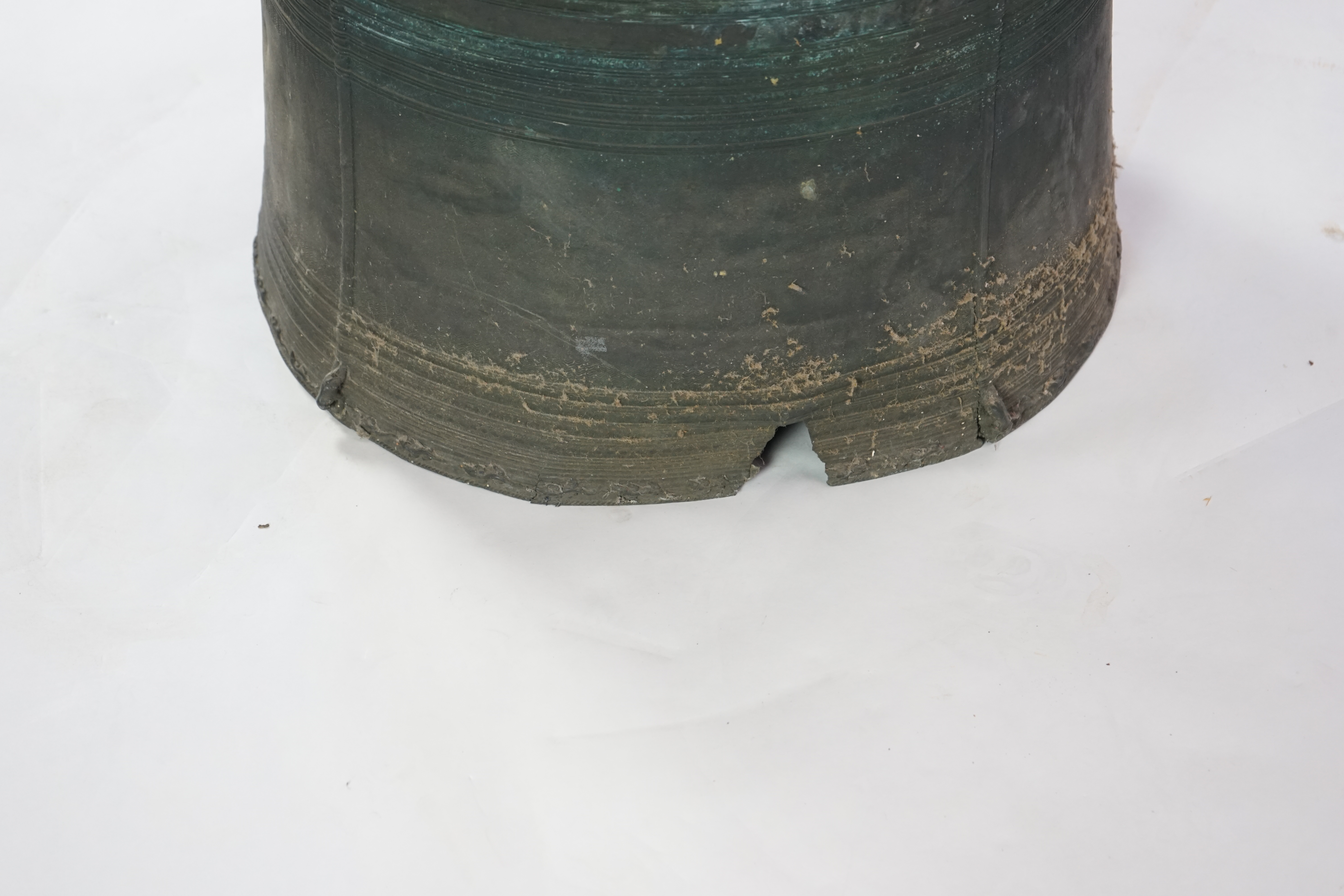 A Shan States bronze rain drum, the concentric ring decorated top mounted with stylised frogs, sides with loop handles and raised ring decoration, 66cm diameter, 57cm high